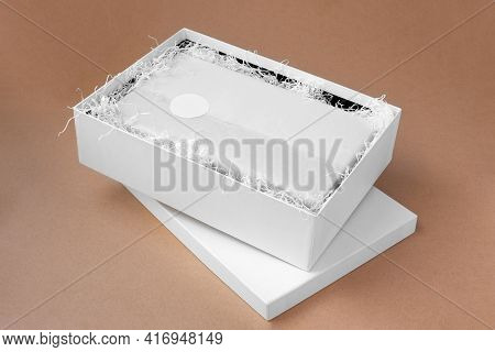 Mock-up Round Blank Sticker Or Tag For Brand Or Logo On White Tissue Paper, Unpacking, White Box On 