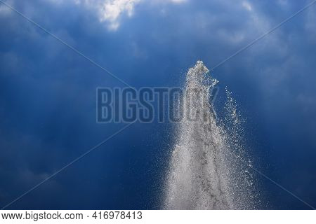 Top Of The Fountain On A Background Of Dark Blue Sky