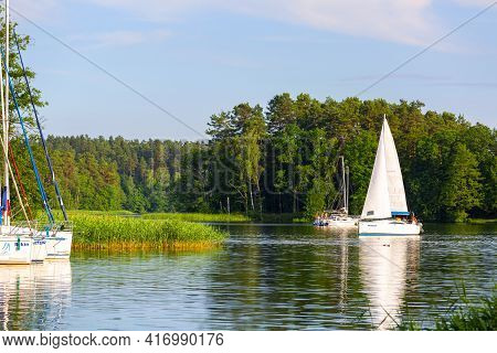 Masuria, Ruciane-nida, Poland - June 24, 2020: Yacht Marina On The Masurian Lakes, Yachts Moored At 