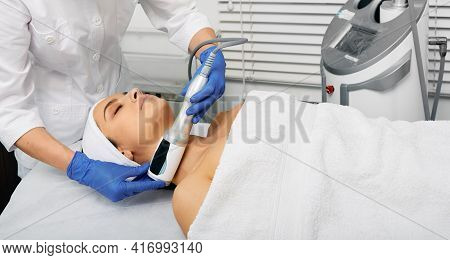Facial Endospheres Therapy For Correction Oval Female Face With Beautician At Modern Cosmetology Cli