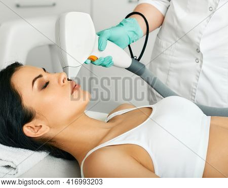 Facial Laser Hair Removal. Mixed Race Woman Getting Laser Hair Removal On Her Face, Laser Epilation 