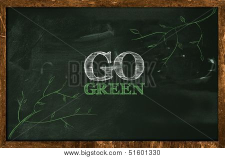 Go Green Text on blackboard
