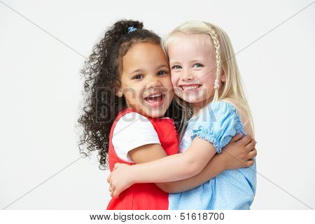 Two Pre School Girls Hugging One Another