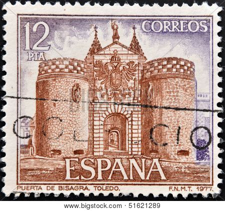 A stamp printed in Spain shows facade of Bisagra door on Toledo