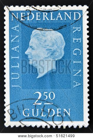 A stamp printed in the Netherlands showing a portrait of Queen Juliana