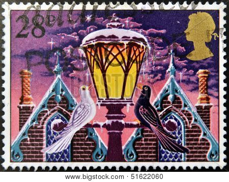 A christmas stamp printed in Grat Britain shows 'Light of Christmas' (street lamp)
