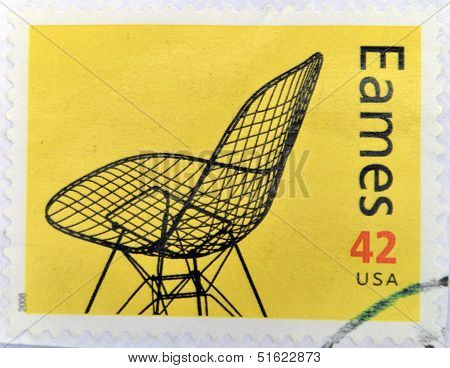 A stamp printed in USA shows eames chair