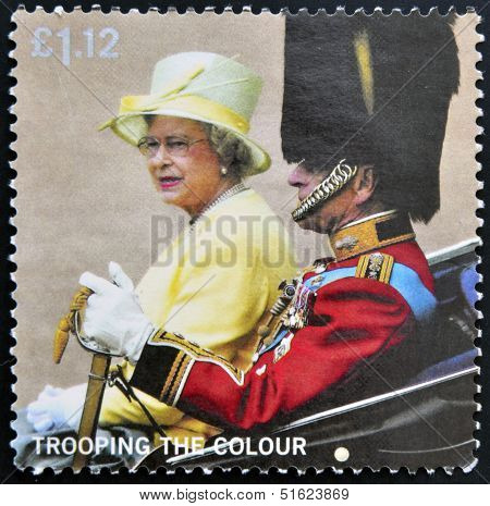 A stamp printed in Great Britain shows Queen and Duke of Edinburgh in Carriage