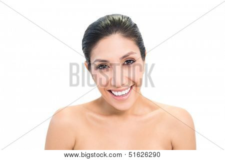 Cheerful brunette model looking at camera on white background