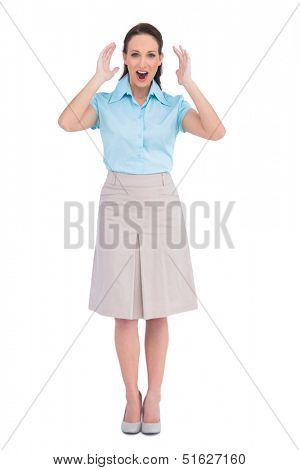 Surprised stylish businesswoman posing on white background