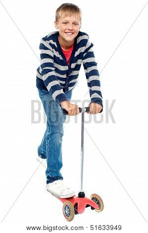 Smart Looking Kid Riding On His Zippy Cycle