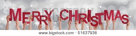 Hands Holding Merry Christmas