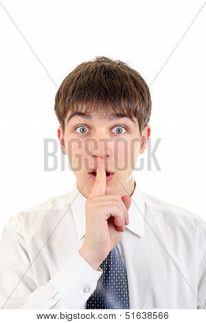 Teenager With Finger On His Lips