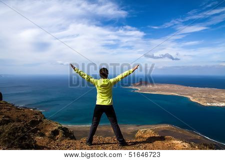 tourist woman on the top of rock