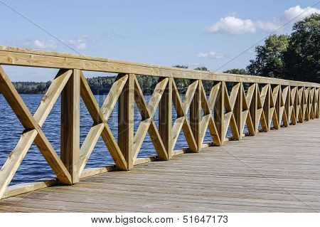 Jetty On Lake At Sunny Day