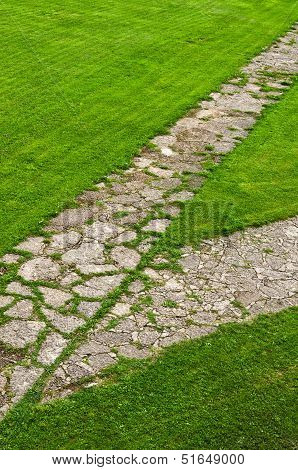 Stone Path Through A Green Lawn