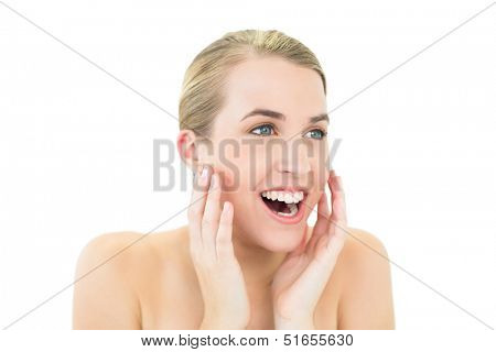 Taken aback gorgeous blonde posing on white background