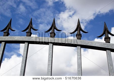 Closeup Section Of Steel Gavanised Gate And Decorative Spikes