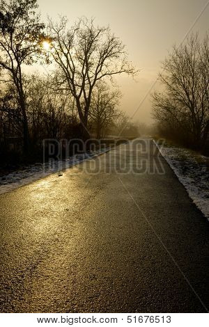 Long road through the winter countryside
