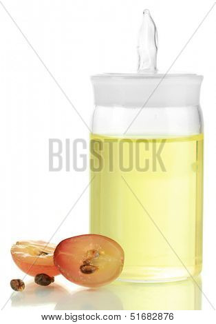 Ripe sliced grape and grapeseed oil, isolated on white