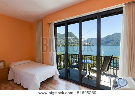 hotel room with exceptional views of the lake and mountains