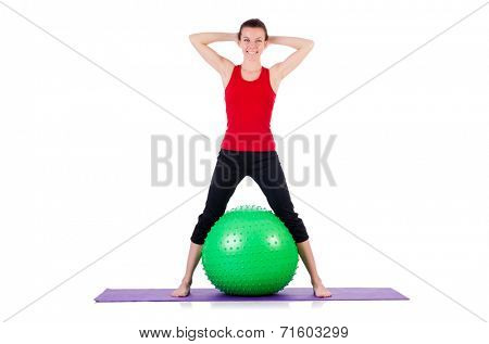 Young woman exercising with swiss ball