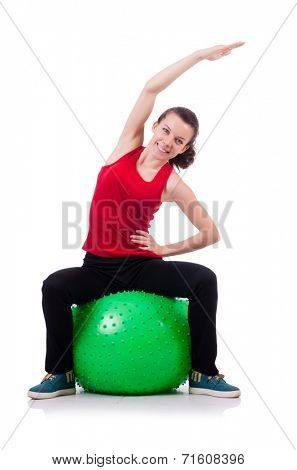 Young woman exercising with swiss ball