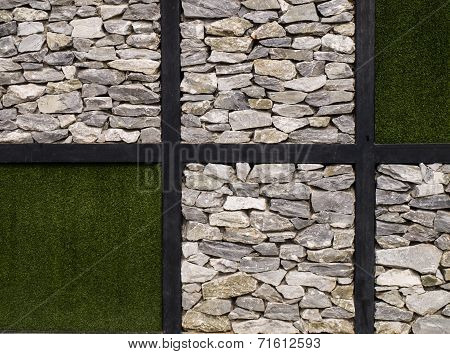 Artificial Grass  And Stone Wall As Background