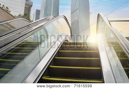 City outdoor escalator under the sun