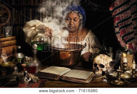 Female alchemist preparing green liquids in a smoking kettle