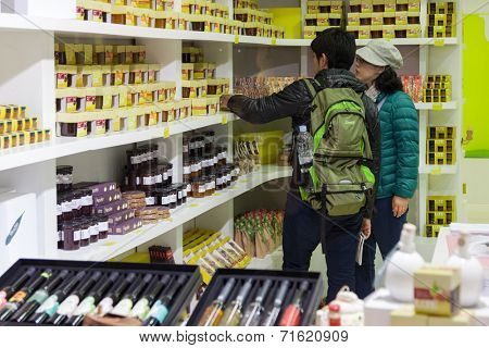 DUBROVNIK, CROATIA - MAY 26, 2014: Tourists in shop called Uje (Dalmatian word for oil) selling traditional and hand made things.