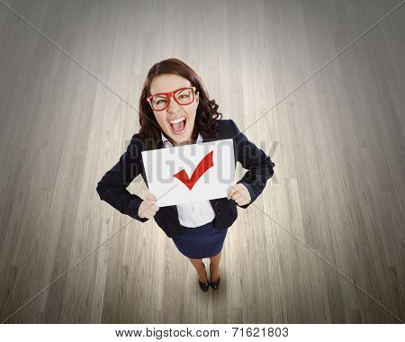 Top view of businesswoman holding white banner with red tick