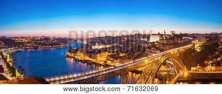 Panorama of Dom Luiz bridge in Porto Portugal at dusk