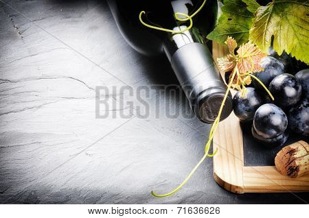 Frame With Red Wine Bottle And Fresh Grape