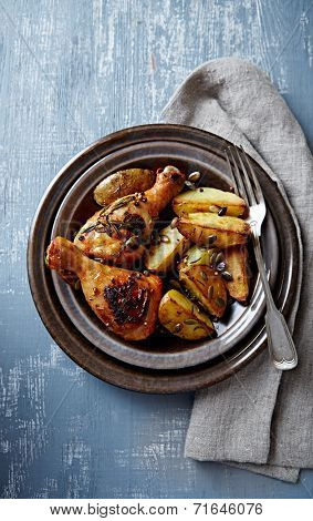 Oven-baked chicken and potatoes with pumpkin seeds (autumn style)