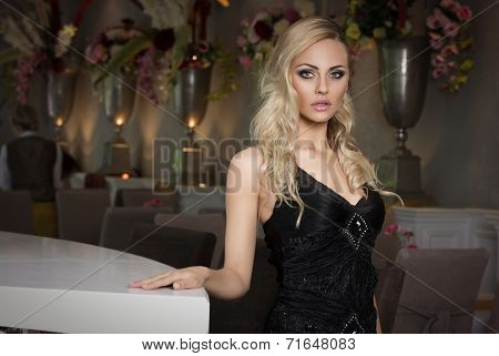 Blond Girl In Cafe In Black Dress
