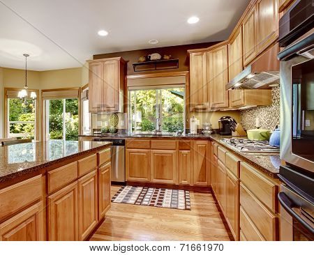 Modern Kitchen Rooom With Island And Granite Tops