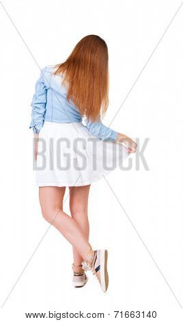 back view of standing young beautiful  woman makes a curtsey. Rear view people collection.  backside view of person.  Isolated over white background.