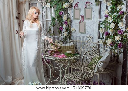 The Girl In A Beautiful Dress Among The Flowers