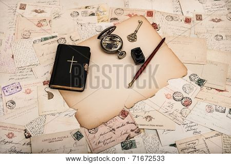 Black Bible Book With Old Postcards And Papers