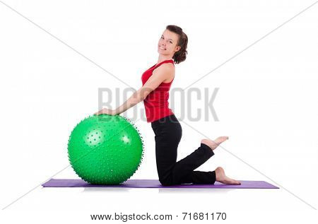Young woman exercising with swiss ball