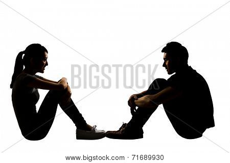 Young couple face to face sit on ground, full length portrait isolated on white.