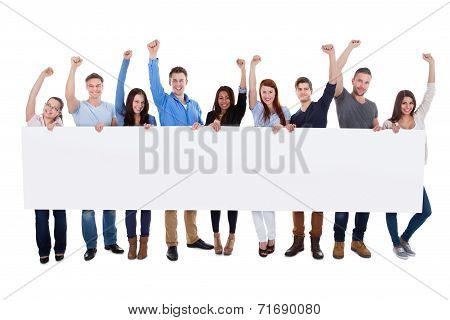 Excited Group Of Diverse People Holding Banner
