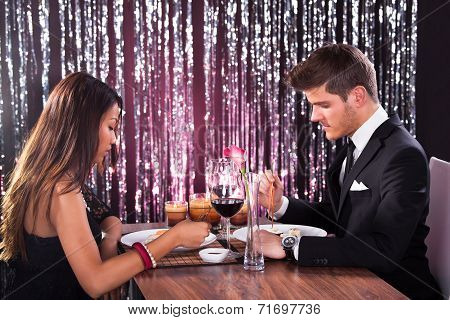 Couple Having Meal At Restaurant