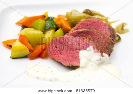 wildebeast steak with grilled vegetables