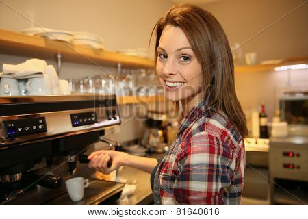 Coffeeshop keeper preparing expresso