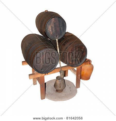 Three wine barrels with wine making equipment