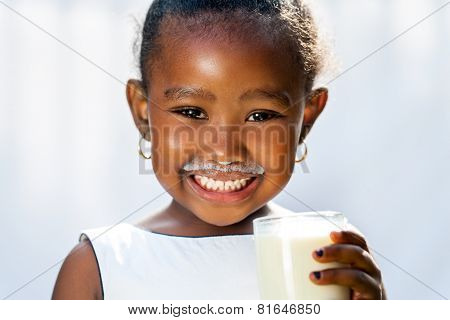 Cute African Girl Showing White Milk Mustache.