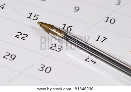 Plastic Pen Over Calendar