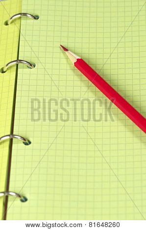 Red Pencil Over Notebook